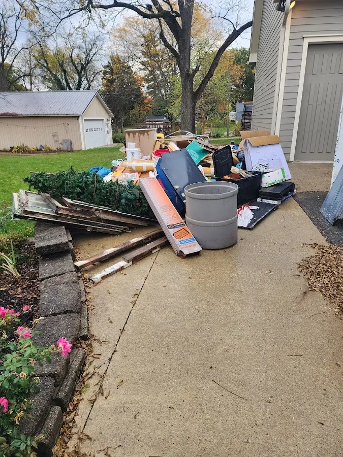 Dumpster being loaded with debris for Roofing Dumpster Rental in DeBary